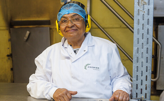 Worker on Mr Kipling production line