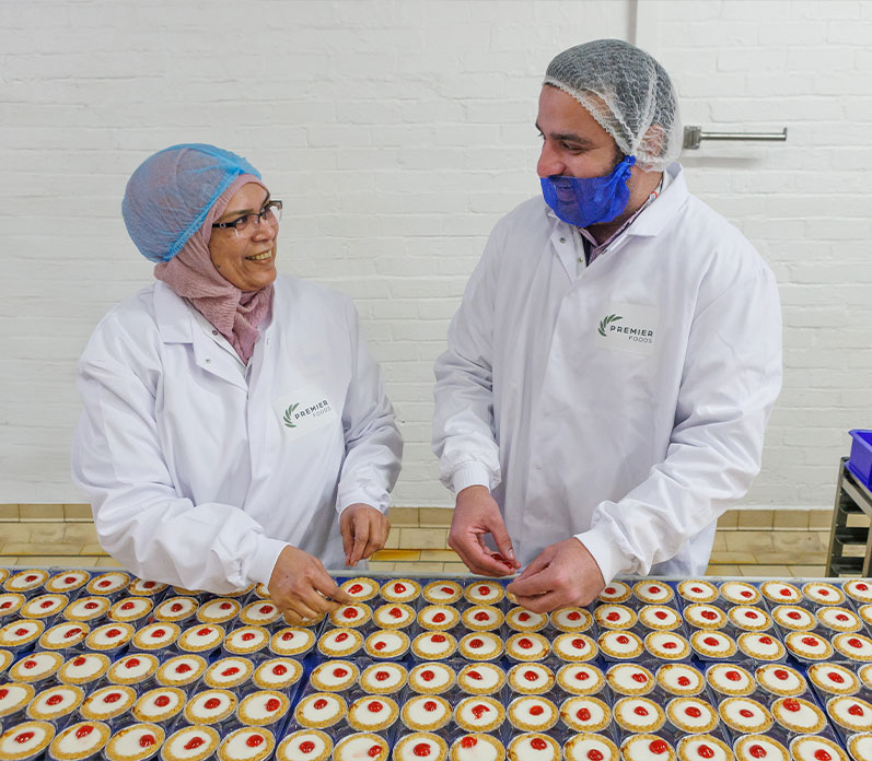 Two colleagues at production line - Mr Kipling cheery bakewells